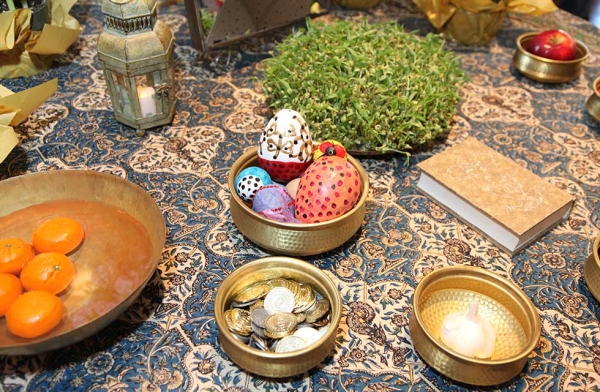 Families created a Haft-Seen, a traditional Nowruz spread featuring seven specific items, at Asia Society New York on March 12, 2016. (Ellen Wallop/Asia Society)