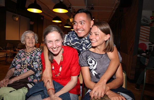 Filmmaker Erik Shirai with friends during a happy hour ahead of the video presentations on June 15, 2016. (Ellen Wallop/Asia Society)