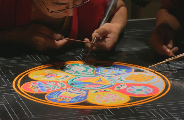 Monks use chak-pur tools and various colored sands to create a sand mandala in Houston, Texas on August 21, 2015. (Joel Luks/Asia Society)