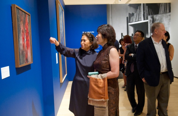 Guests look on at work by Zao Wou-Ki at Asia Society New York on September 8, 2016. (Elena Olivo/Asia Society)