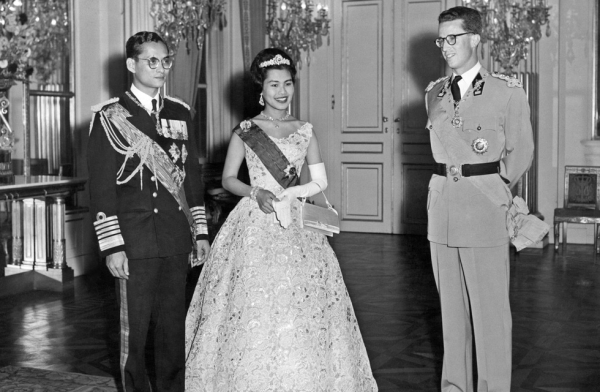 Thai King Bhumibol Adulyadej (L) and Queen Sirikit (C) stand near Belgium King Baudouin I, on October 1960 in Brussels, during their official visit to Belgium. (AFP/Getty Images)