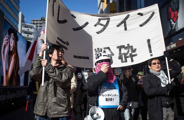 A group of Japanese men protest Valentine's Day on February 14, 2015 in Tokyo, Japan. The protest was organized by a group called Kakuhido, meaning the Revolutionary Alliance of Unpopular People who aim to 'crush Valentine's Day' and to not 'fall victim to 'chocolate capitalists.' In Japan, females customarily give chocolates to males to confess their feelings for them or to express gratitude. (Chris McGrath/Getty)