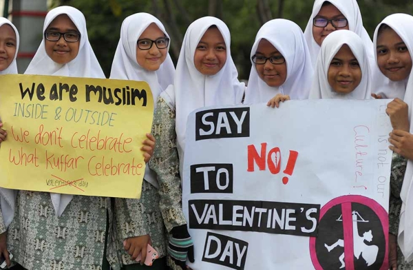 Indonesian Muslim students campaign against the celebration of Valentine's Day in Banda Aceh, Indonesia on February 13, 2016. Chaideer Mahyuddin/AFP/Getty)