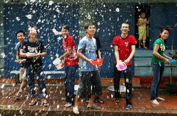 Young people line up to splash water on each other during the Songkran festival on April 13, 2008, in Luang Prabang, Laos. (Chumsak Kanoknan/Getty Images)