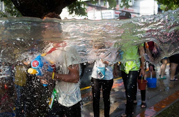 Thai locals and foreigners take part in a city-wide water fight on April 15, 2015 in Chiang Mai, Thailand. (Taylor Weidman/Getty Images)
