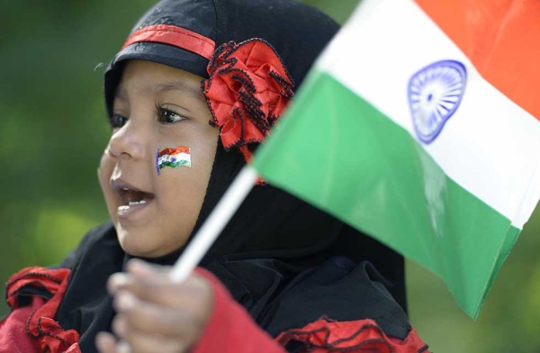 An Indian girl holds a flag during Independence Day celebrations in Secunderabad, the twin city of Hyderabad, on August 15, 2017. (Noah Seelam/AFP/Getty)