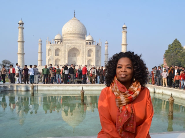 Oprah Winfrey in front of the Taj Mahal on January 19, 2012. Winfrey was on her first visit to India to film an episode of her show 'Oprah’s Next Chapter.' (STRDEL/AFP/Getty Images) 
