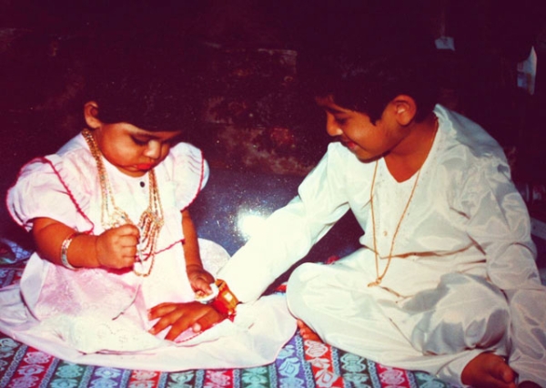 On the Indian holiday Rakhi, or Rakshabandan, brothers and sisters celebrate their relationship by tying a decorative thread (also called a rakhi) around each other's wrists. (Vivek Patel)