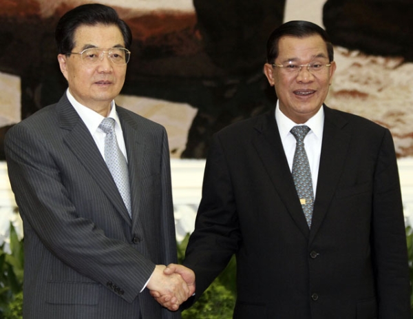 Then-President of China Hu Jintao (L) is welcomed by Cambodian Prime Minister Hun Sen (R) in Phnom Penh on March 31, 2012. Hu arrived in the Cambodian capital on a state visit to bolster ties between the already-close nations. (Pring Samrang/AFP/Getty Images) 