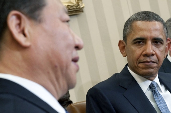U.S. President Barack Obama, right, listens as then Chinese Vice President Xi Jinping speaks during a meeting in the Oval Office on Feb. 14, 2012. (Saul Loeb/AFP/Getty Images)