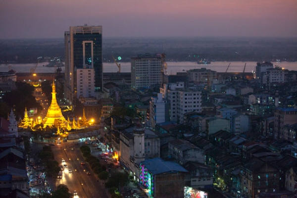 Rush hour traffic moves near by the Sule Pagoda at dusk December 14, 2011 in Yangon, Myanmar. (Paula Bronstein/Getty Images) 