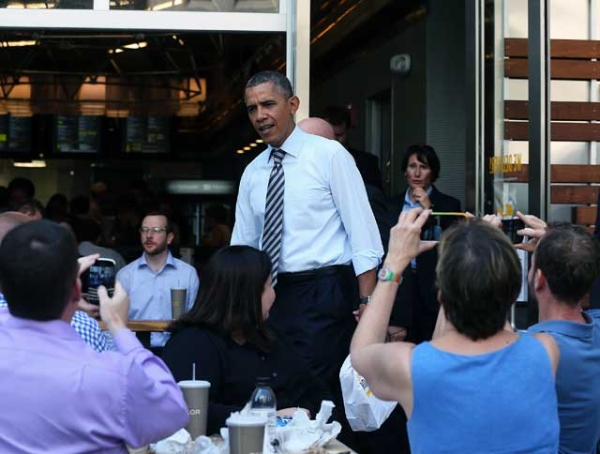 Not going anywhere: U.S. President Barack Obama walks out of the Taylor Gourmet Deli in Washington, DC on Oct. 4, 2013. Obama canceled this weekend's trip to Asia as  the federal government as the shutdown went into its fourth day. (Mark Wilson/Getty Images) 