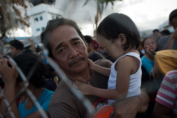 Typhoon victims wait to have a chance to board a flight to evacuate the area at Tacloban airport on November 14, 2013. (Nicolas Asfouri/AFP/Getty Images)