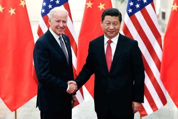 Chinese President Xi Jinping (R) shakes hands with US Vice President Joe Biden (L) inside the Great Hall of the People in Beijing on December 4, 2013. (Lintao Zhang/AFP/Getty Images)