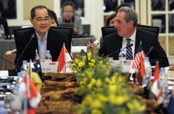 Singapore Minister of Trade and Industry Lim Hng Kiang (L) speaks as US trade representative Michael Froman (R) looks on during the Trans-Pacific Partnership (TPP) Ministerial Meeting in Singapore on May 19, 2014. Trade Ministers and officials from the 12 TPP countries -- Australia, Brunei, Canada, Chile, Japan, Malaysia, Mexico, New Zealand, Peru, the US, Vietnam and Singapore -- convened for the meeting. (Roslan Rahman/AFP/Getty Images)