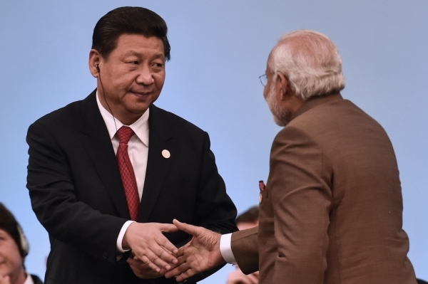 China’s President Xi Jinping (L) shakes hands with India’s Prime Minister Narendra Modi during the 6th BRICS Summit in Fortaleza, Brazil, on July 15, 2014. (Yasuyoshi Chiba/Getty Images)