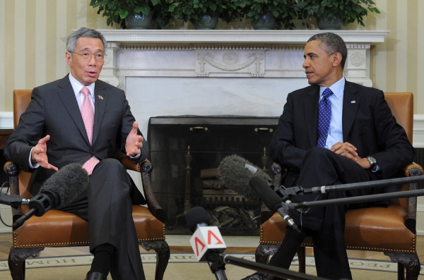 U.S. President Barack Obama (R) listens as Singapore’s Prime Minister Lee Hsien Loong speaks to the media before their bilateral meeting in the Oval Office at the White House in Washington, D.C., on April 2, 2013. (Jewel Samad/Getty Images)