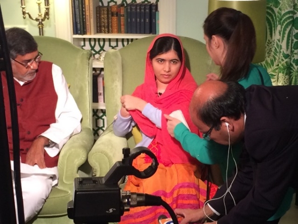 Yusra Sami Askari, in green, prepares Malala Yousafzai for an on-camera interview in Oslo. (Yusra Sami Askari)