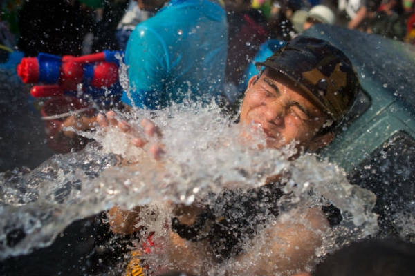 Thai locals and foreigners take part in a city-wide water fight on April 15, 2015 in Chiang Mai, Thailand. (Photo by Taylor Weidman/Getty Images)