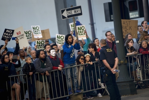 People protesting the Trans-Pacific Partnership (TPP) gather as US President Barack Obama attends a fund raiser for the Democratic National Committee at the Sentinel Hotel May 7, 2015 in Portland, Oregon. (Brendan Smialowski/AFP/Getty Images)