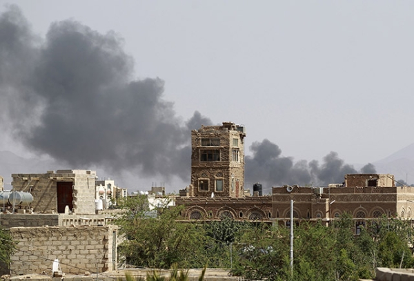 Smoke billows following air-strikes by the Saudi-led coalition on a weapons depot at a military airport, currently controlled by Yemeni Shiite Huthi rebels, in the capital Sanaa on August 20, 2015.  (Mohammed Huwais/AFP/Getty Images)