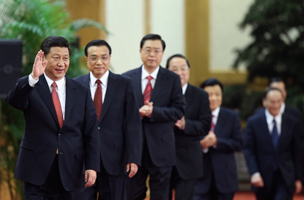 Members of China's incoming Politburo Standing Committee, led by Communist Party General Secretary Xi Jinping, greet the media at the Great Hall of the People on November 15, 2012 in Beijing. (Feng Li/Getty Images)