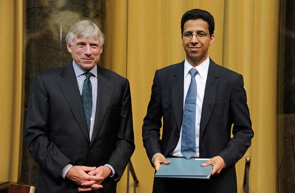 David Barboza (R) receives an award from Columbia University President Lee C. Bollinger at the annual Pulitzer Prizes in Journalism, Letters, Drama, and Music Winners Luncheon at Columbia University on May 30, 2013 in New York City. (Dave Kotinsky/Getty Images)