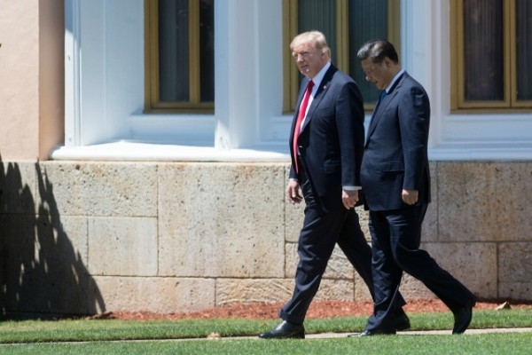 US President Donald Trump (L) and Chinese President Xi Jinping (R) walk together at the Mar-a-Lago estate in West Palm Beach, Florida, April 7, 2017. (Jim Watson/AFP/Getty Images)