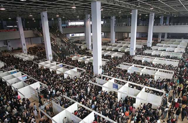 Students pack into a Chengdu, China job fair in 2005. Some 40,000 students competed for 10,000 jobs at the fair. (China Photos/Getty Images)