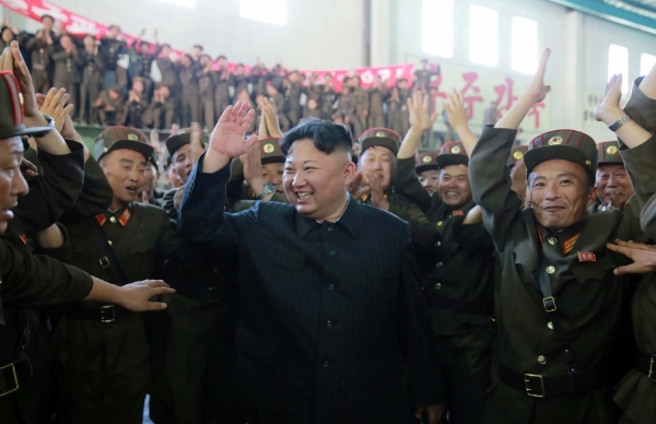  Kim Jong-Un (C) celebrates the successful test-fire of the intercontinental ballistic missile Hwasong-14 at an undisclosed location. (SPR/AFP/Getty Images)