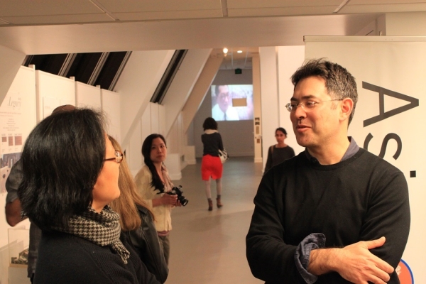 Artist Daniel Traub talks to an attendee at "Retrieved: The Art of Looking Back" on February 22, 2016. ASNC partnered with the Chinese Culture Center, and featured the art and a discussion with Traub and Kurt Tong.  Lanchih Po, Professor at U.C. Berkeley, moderated the talk. (Asia Society)