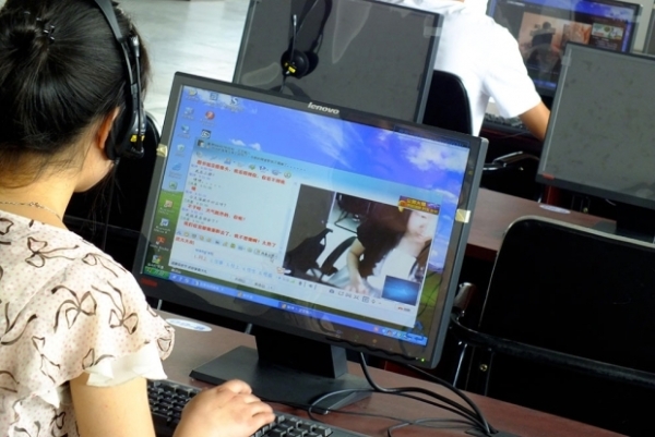 A netizen surfs the web at an Internet cafe in Yichang city, Hubei province. (Yi Chang—Imagine China/Zuma Press)