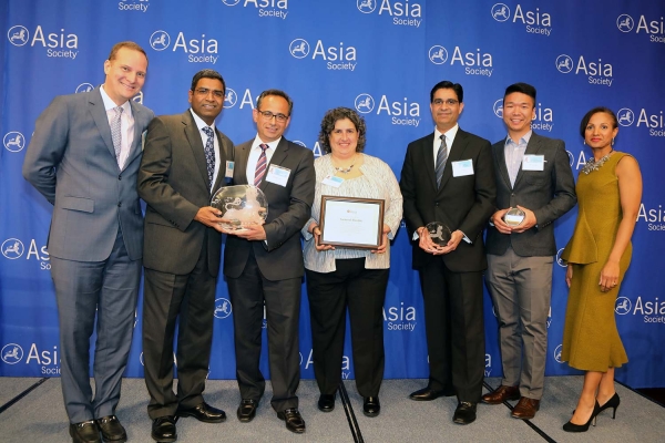 Mahendra Nair (L2) on behalf of General Electric receives the award for Best Employer for Marketing & Support to APA Community. (Ellen Wallop/Asia Society)