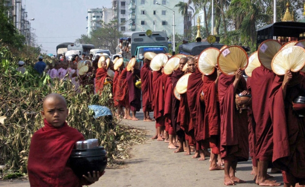 Buddhist monks make their way through the streets to collect offerings in Yangon on May 8, 2009. (Hla Hla Htay/AFP/Getty Images)