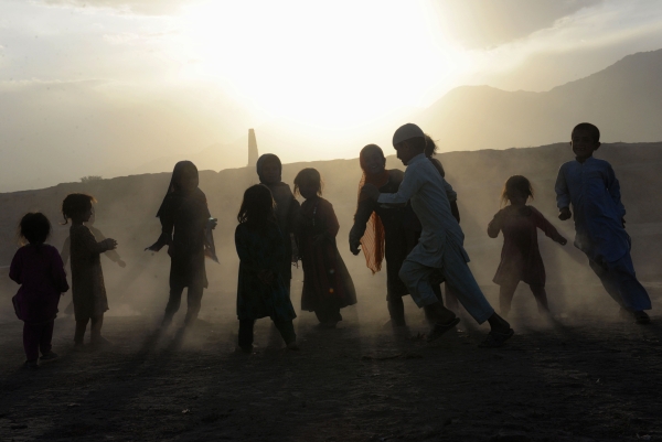 Afghan children play on the outskirts of Jalalabad