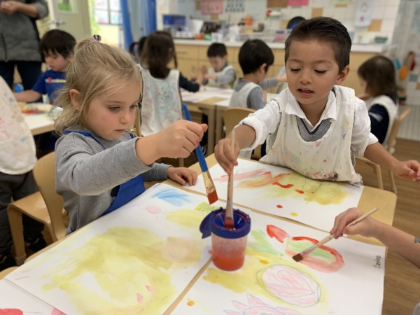 Students painting during art class