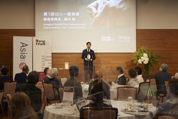 Mr. Takuya Tsutsumi making a speech after winning the Ronnie Prize