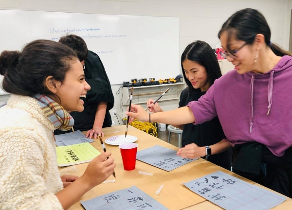 Students enjoy a calligraphy workshop