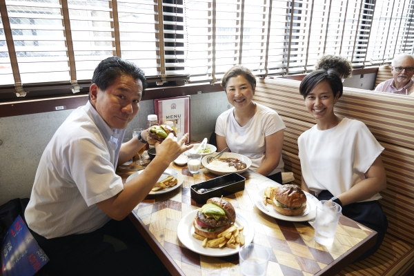 Founding Member Kosei Kobayashi about to bite into his Tsunami avocado burger!