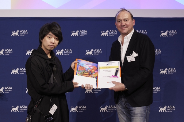 Yoichi Ochiai receiving a certificate