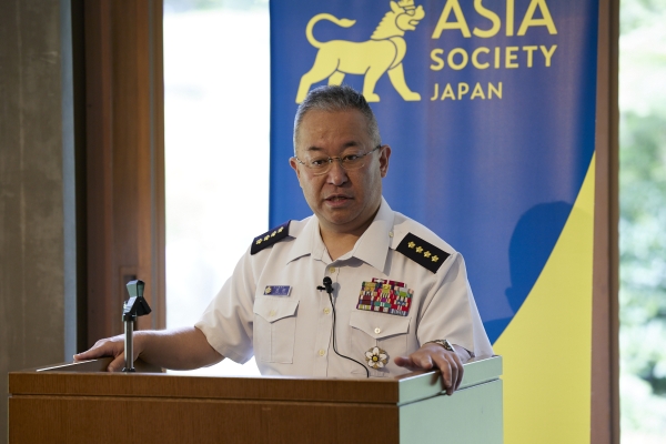 General YOSHIDA Yoshihide on podium talking to the audience