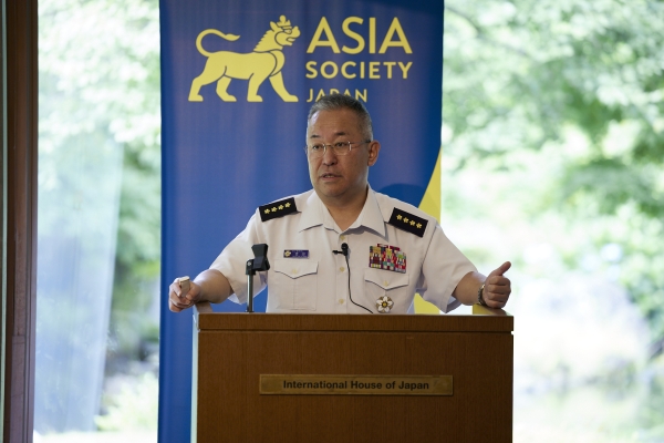 General YOSHIDA speaking to the audience at the podium