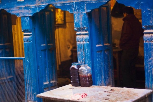 Goat blood is stored in bottles outside a shop selling meat in
Thamel, Kathmandu. (Sai Abishek)
