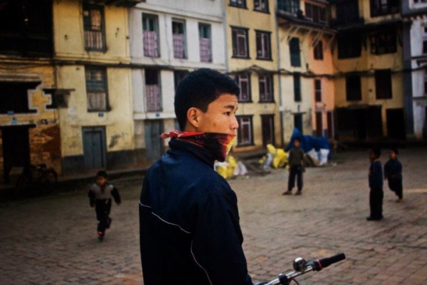 A teenager "fashionably" wears a scarf in Kathmandu. "It is something of a leftover from the bird flu scare." (Sai Abishek)

