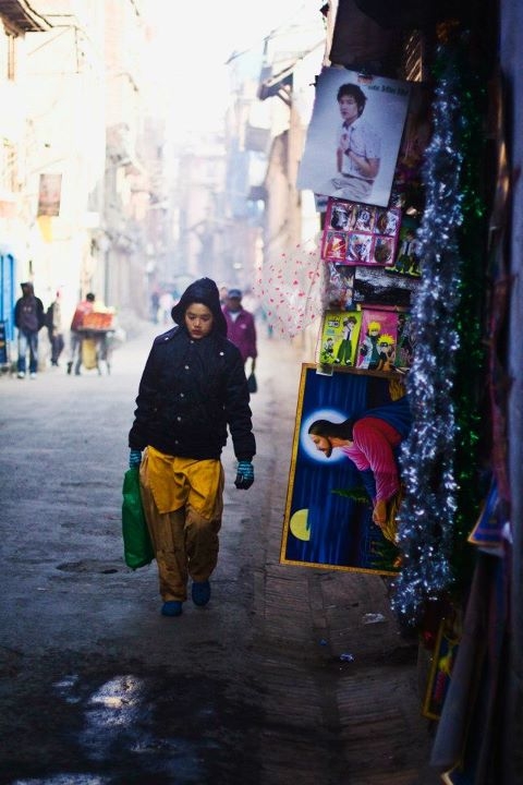 A woman walks on the street during Christmas in Thamel, Kathmandu. (Sai Abishek)