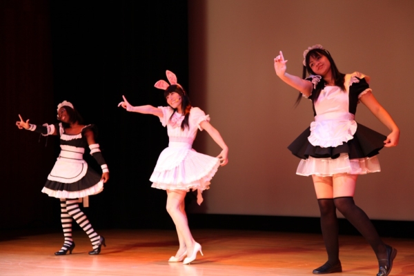 Cosplay singer and judge Reni Mimura (center) performs her opening number, &quot;Kitty-chan.&quot; (Leah Thompson/Asia Society)
