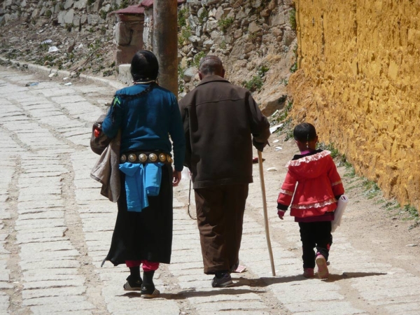 Family walking at Ganden Monastery. (Jessica Kehayes)