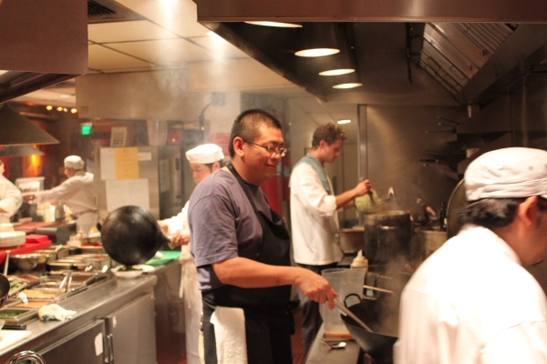 Alex Ong and his team at Betelnut prepare dishes from Naomi's cookbook. (Asia Society)
