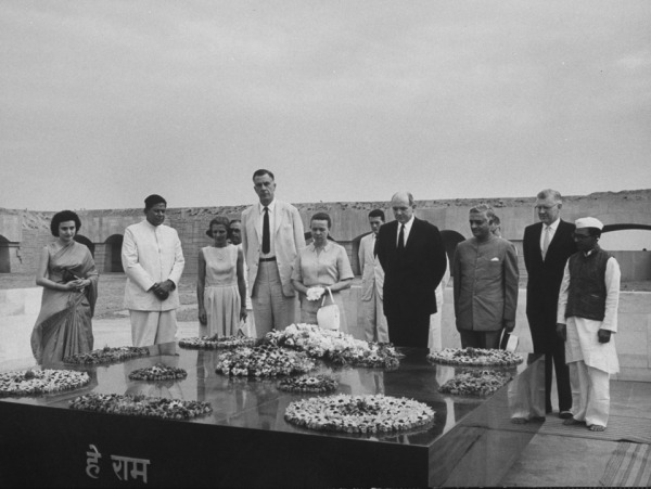 Indira Gandhi (far left), US Ambassador to India John Kenneth Galbraith (white suit, 5th from left) and wife, Dean Rusk and wife (center), and Phillips Talbot (2nd from right) visiting Raj Ghat, the memorial marking Gandhi&apos;s cremation place, in May 1963. (James Burke/Time Life Pictures/Getty Images)
