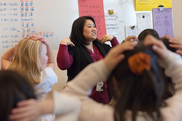At Beacon Hill International School, a Mandarin Immersion teacher leads her class in a song, adding to the fun of learning Chinese language. 